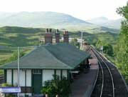 Last (only!) train home. Rannoch Station is at around 900 ft / 300m above sea level. Dundee is at sea level. So, yes they go up hills.